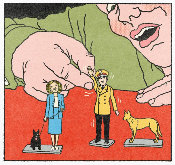 Un homme joue avec une figurine d'Hitler et d’Eva Braun